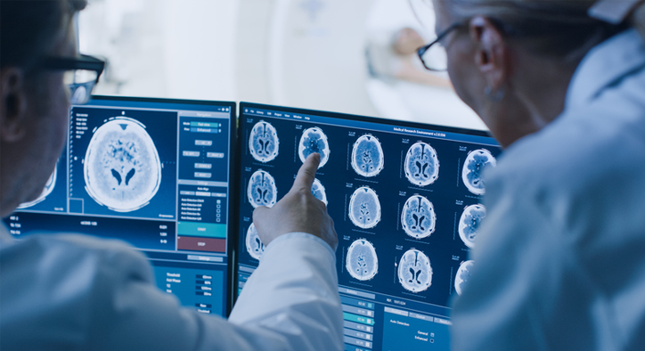 Doctors reviewing traumatic brain injury scan